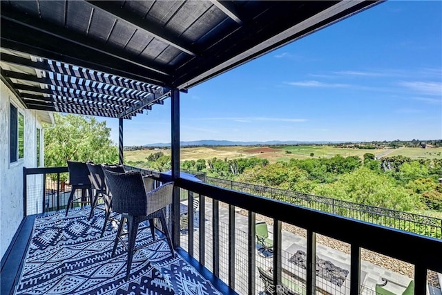 balcony featuring a pergola
