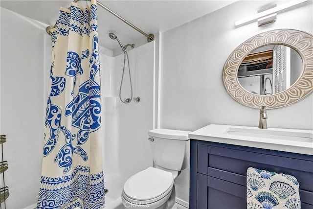 full bathroom with vanity, toilet, and curtained shower