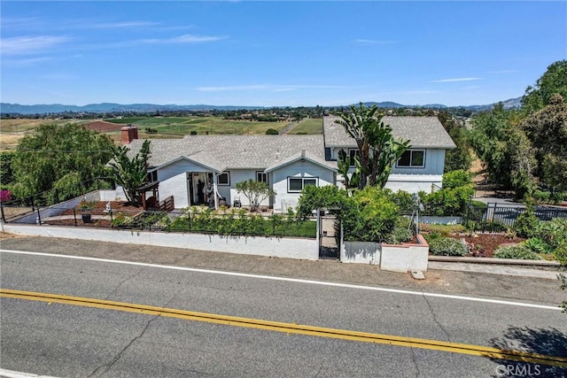 1864 Winterwarm Dr, Fallbrook, CA 92028 - ranch-style house with a fenced front yard and a mountain view