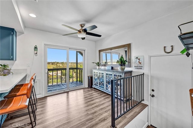 interior space featuring recessed lighting, a ceiling fan, and wood finished floors