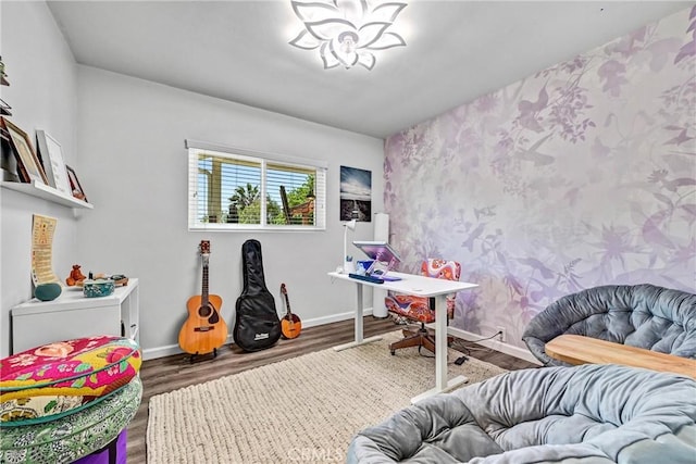 interior space with baseboards, wallpapered walls, and wood finished floors