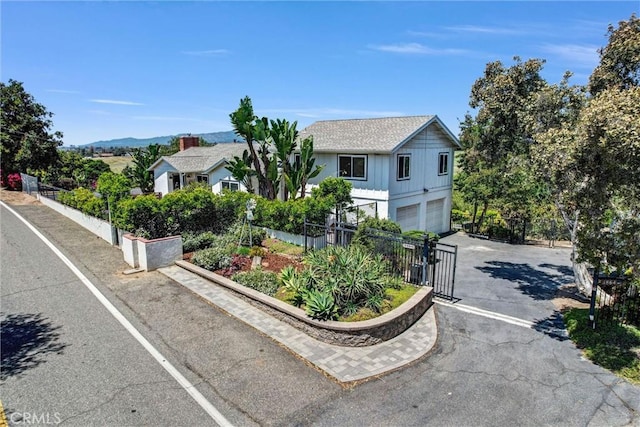 1864 Winterwarm Dr, Fallbrook, CA 92028 - view of front of property with asphalt driveway and a garage