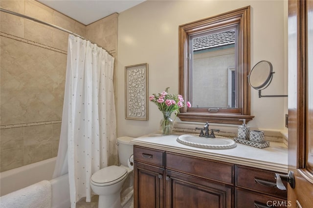 bathroom with vanity, shower / tub combo, and toilet