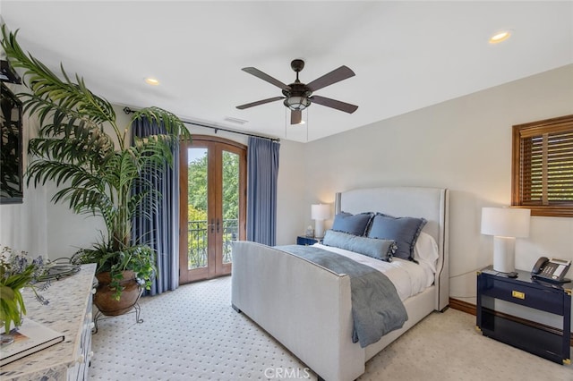 bedroom featuring access to outside, recessed lighting, light carpet, and french doors