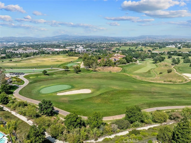 drone / aerial view featuring a mountain view and view of golf course