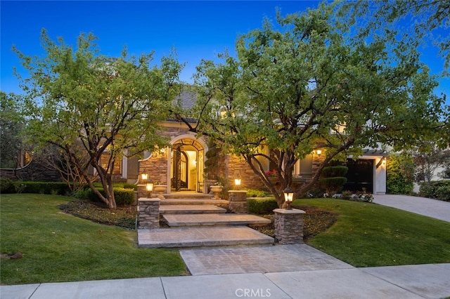 obstructed view of property with a front yard