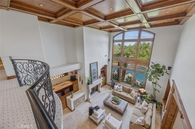 living area with recessed lighting, beamed ceiling, and coffered ceiling