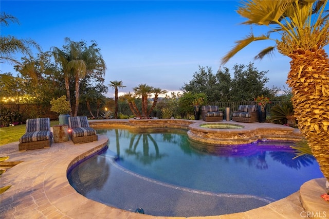 view of swimming pool with a fenced in pool, a patio, an in ground hot tub, and a fenced backyard