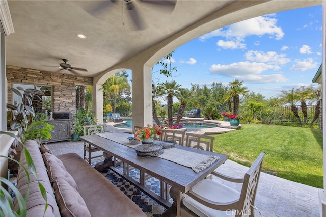 view of patio / terrace with outdoor lounge area, a ceiling fan, outdoor dining space, and an outdoor pool