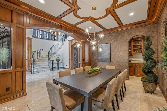 dining space with crown molding, stairway, recessed lighting, arched walkways, and coffered ceiling