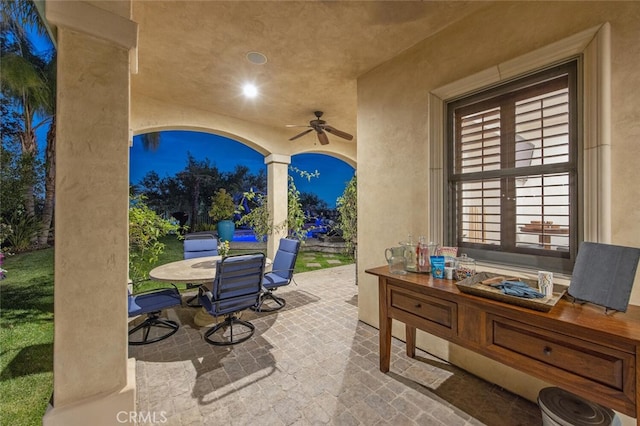 view of patio featuring a ceiling fan and outdoor dining space