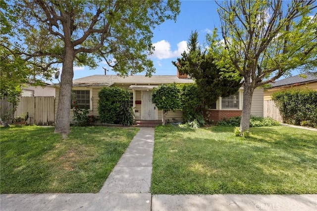 545 S Zeyn, Anaheim, CA 92805 - view of front of property with brick siding, a front lawn, and fence