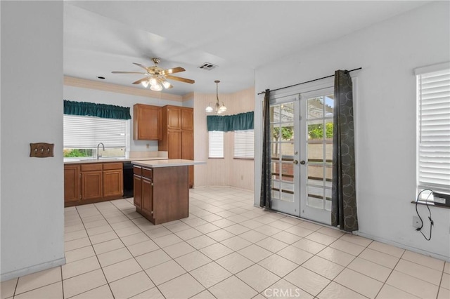 kitchen featuring visible vents, black dishwasher, light countertops, french doors, and a sink