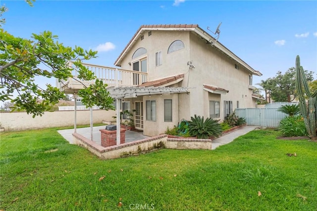 back of property featuring a patio, a fenced backyard, a lawn, and stucco siding
