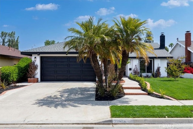 24531 Bunbury Dr, Lake Forest, CA 92630 - view of front of house featuring an attached garage, stucco siding, driveway, and a front lawn