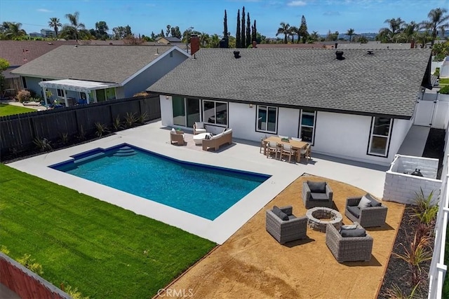24531 Bunbury Dr, Lake Forest, CA 92630 - back of property featuring roof with shingles, an outdoor living space with a fire pit, a fenced backyard, a patio area, and a lawn