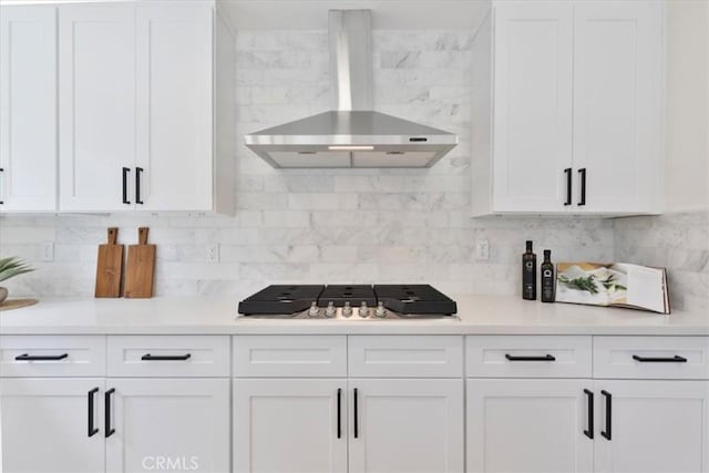 24531 Bunbury Dr, Lake Forest, CA 92630 - kitchen featuring wall chimney range hood, white cabinets, and backsplash