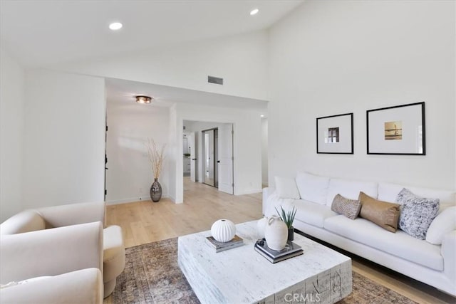 24531 Bunbury Dr, Lake Forest, CA 92630 - living area with visible vents, light wood-type flooring, baseboards, lofted ceiling, and recessed lighting