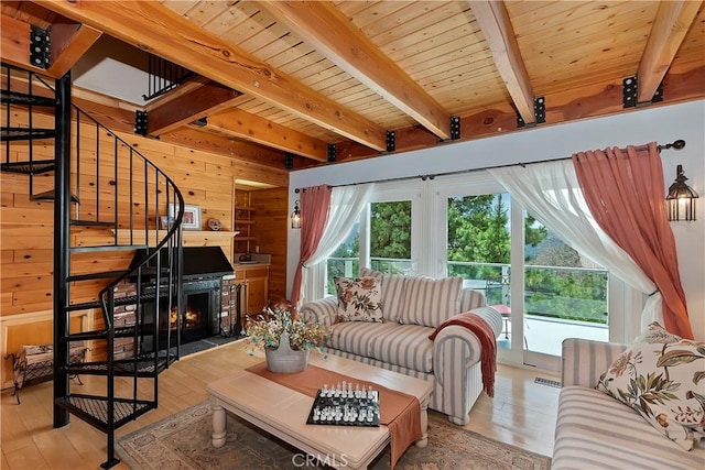 27720 St Bernard Ln, Lake Arrowhead, CA 92352 - living area featuring wooden walls, stairs, wooden ceiling, light wood-type flooring, and beamed ceiling