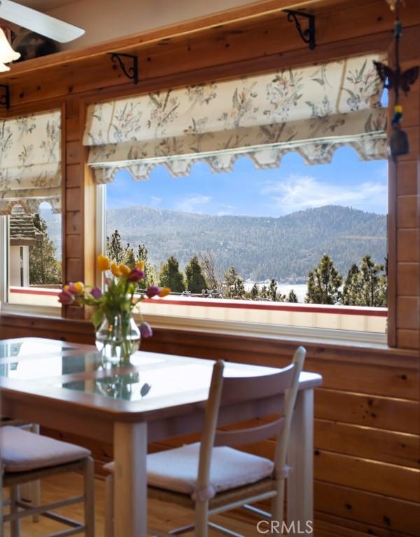 27720 St Bernard Ln, Lake Arrowhead, CA 92352 - dining space with wooden walls and a mountain view