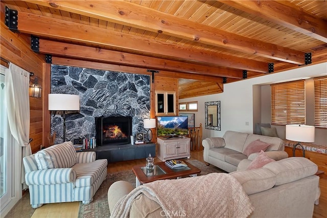 27720 St Bernard Ln, Lake Arrowhead, CA 92352 - living area featuring a fireplace, wood finished floors, wooden ceiling, and beamed ceiling