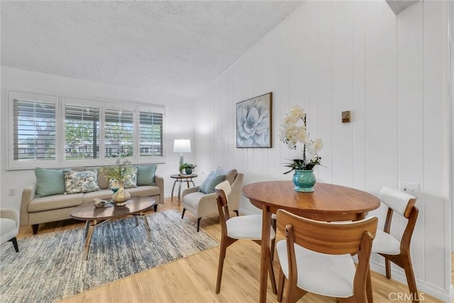 interior space featuring a textured ceiling and wood finished floors