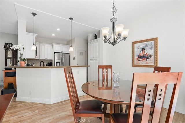 655 Via Colinas, Thousand Oaks, CA 91362 - dining area with light wood-style floors, a chandelier, recessed lighting, and baseboards