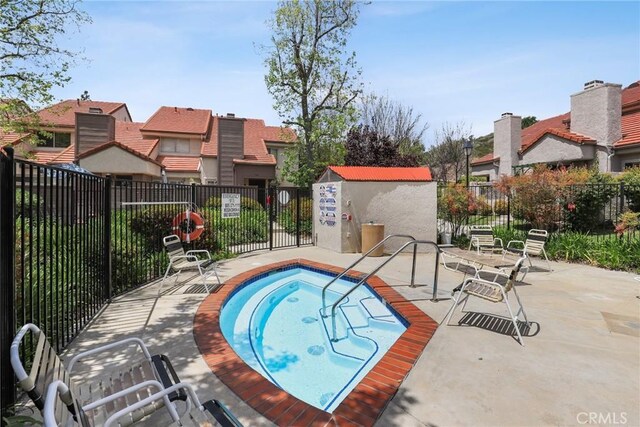 655 Via Colinas, Thousand Oaks, CA 91362 - view of swimming pool with fence, a residential view, a patio area, and a community hot tub