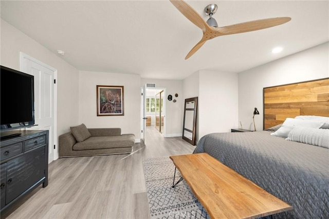 bedroom with visible vents, light wood finished floors, ceiling fan, and baseboards