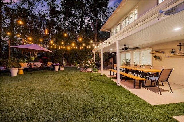 view of yard with a patio and ceiling fan