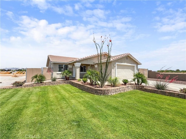 509 Kristi Ln, Blythe, CA 92225 - ranch-style home featuring a tiled roof, an attached garage, a front yard, and stucco siding