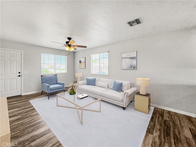 509 Kristi Ln, Blythe, CA 92225 - living area featuring baseboards, wood finished floors, and visible vents