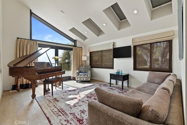 30140 Tuttle Ct, Tehachapi, CA 93561 - living area with high vaulted ceiling and light wood-type flooring