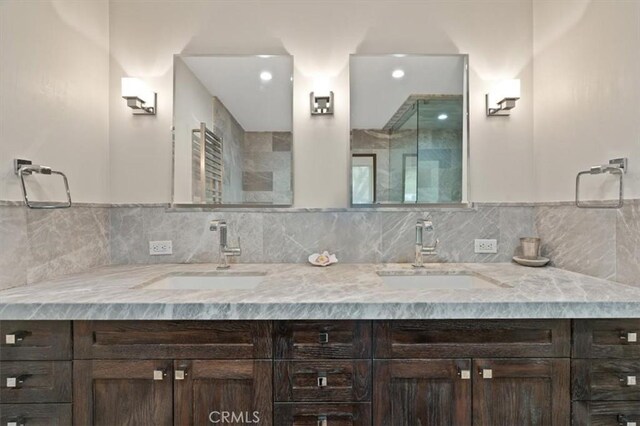 30140 Tuttle Ct, Tehachapi, CA 93561 - bathroom featuring a sink, backsplash, recessed lighting, and double vanity