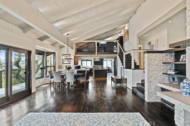 30140 Tuttle Ct, Tehachapi, CA 93561 - dining area featuring beam ceiling, wood-type flooring, high vaulted ceiling, stairs, and wooden ceiling