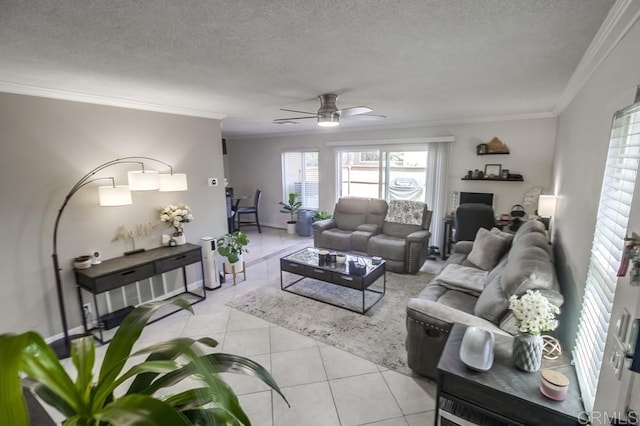 living area featuring crown molding, a textured ceiling, ceiling fan, and light tile patterned flooring