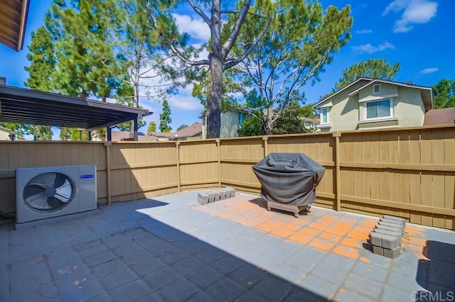 view of patio / terrace featuring fence, ac unit, and area for grilling