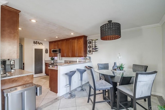 dining space featuring crown molding, recessed lighting, baseboards, and light tile patterned floors