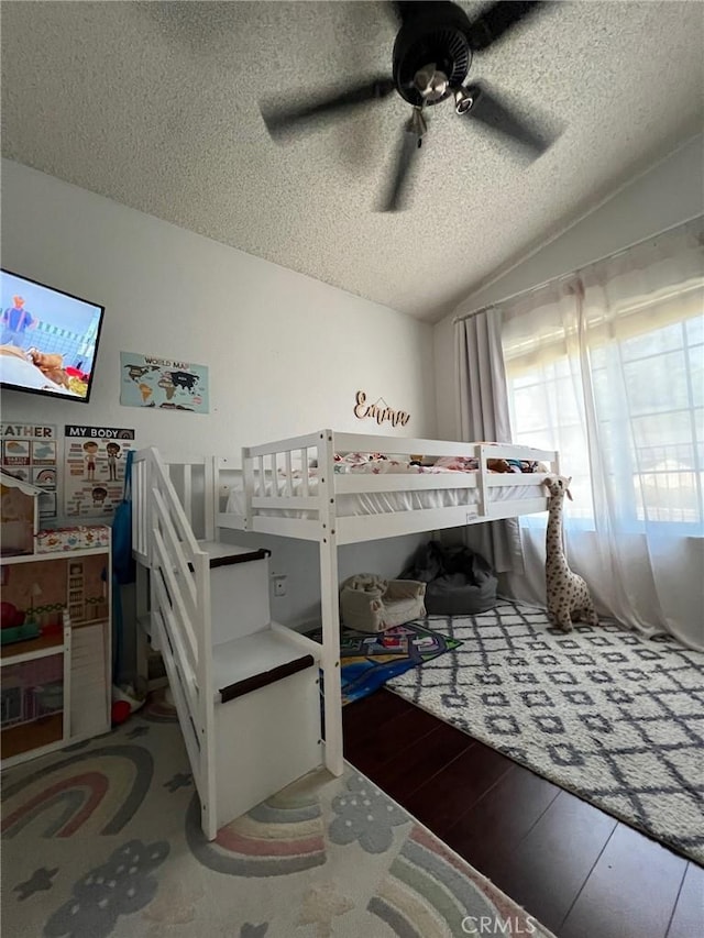 8871 Knollwood Pl, Rancho Cucamonga, CA 91730 - bedroom with vaulted ceiling, a textured ceiling, ceiling fan, and wood finished floors