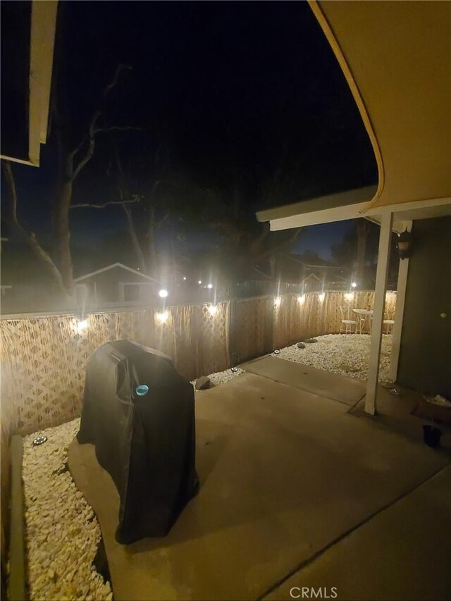 8871 Knollwood Pl, Rancho Cucamonga, CA 91730 - patio at night featuring a patio area and a fenced backyard