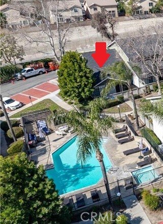 8871 Knollwood Pl, Rancho Cucamonga, CA 91730 - aerial overview of property's location featuring a pool and nearby suburban area