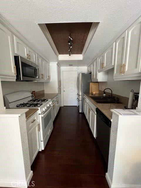 8871 Knollwood Pl, Rancho Cucamonga, CA 91730 - kitchen with stainless steel appliances, a raised ceiling, a sink, white cabinetry, and dark wood-style flooring