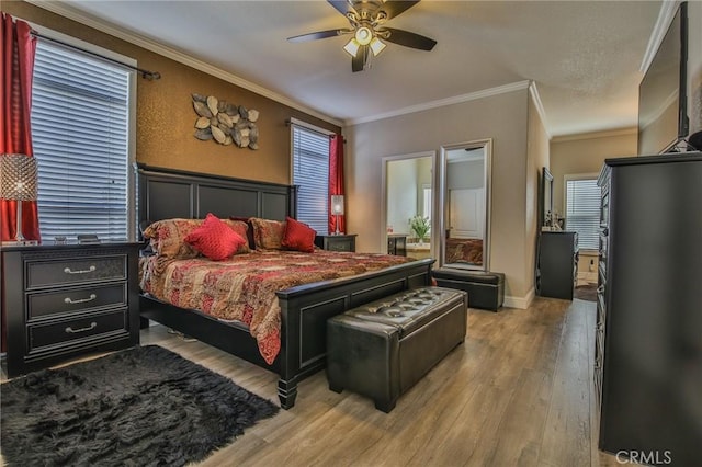 3595 Santa Fe Ave, Long Beach, CA 90810 - bedroom featuring crown molding, wainscoting, ceiling fan, and wood finished floors