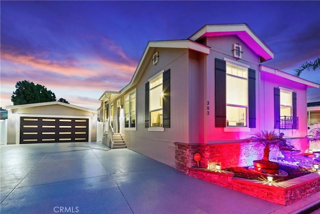 3595 Santa Fe Ave, Long Beach, CA 90810 - property exterior at dusk with a garage, an outbuilding, and crawl space