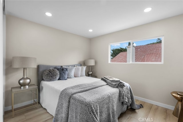 bedroom featuring recessed lighting, baseboards, and wood finished floors