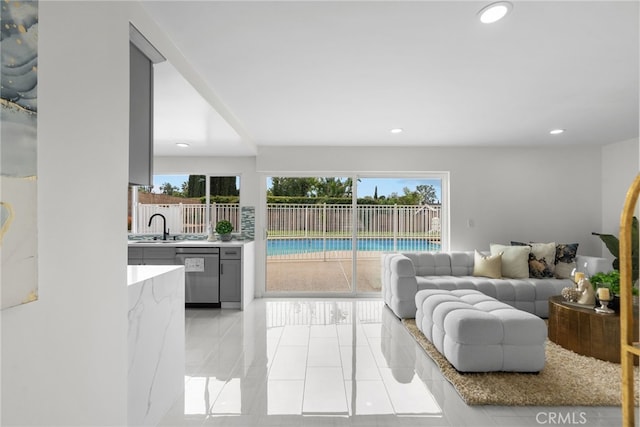 living area with light tile patterned flooring and recessed lighting