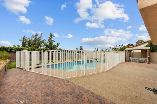 view of pool featuring a fenced in pool, fence, a gazebo, and a patio area