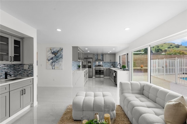 living room with recessed lighting and baseboards