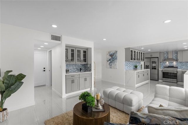 living area featuring recessed lighting, baseboards, visible vents, and light tile patterned flooring