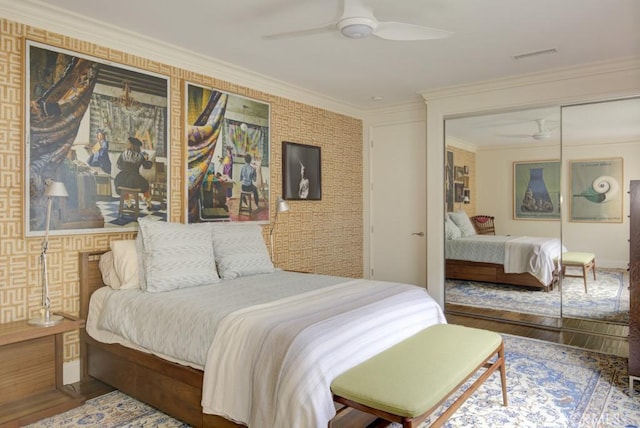 5594 Avenida Sosiega W Unit B, Laguna Woods, CA 92637 - bedroom featuring crown molding, visible vents, a closet, wood finished floors, and ceiling fan